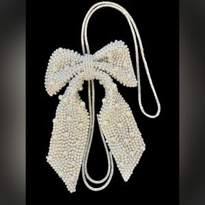 Elegant Cream Pearl Bow-lo on sparkly cord